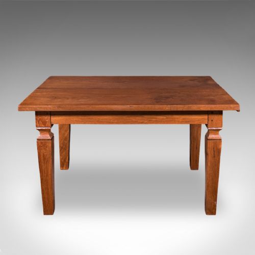 fig 3. An Edwardian rectangular English walnut dining table featuring tapered legs with carved collars and a smooth polished top.