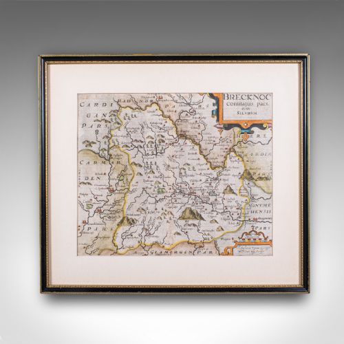 fig 1. A framed 1607 hand-coloured antique map of Brecknoc set within a cream mount and a dark frame with gold trim.
