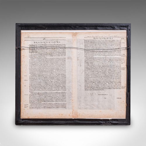 fig 2. A framed 1607 hand-coloured antique map of Brecknoc set within a cream mount and a dark frame with gold trim.