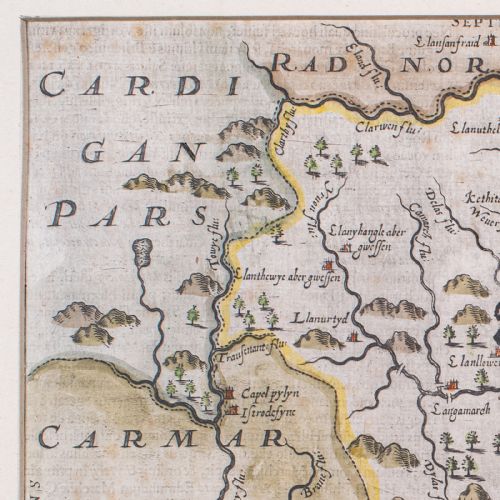 fig 5. A framed 1607 hand-coloured antique map of Brecknoc set within a cream mount and a dark frame with gold trim.