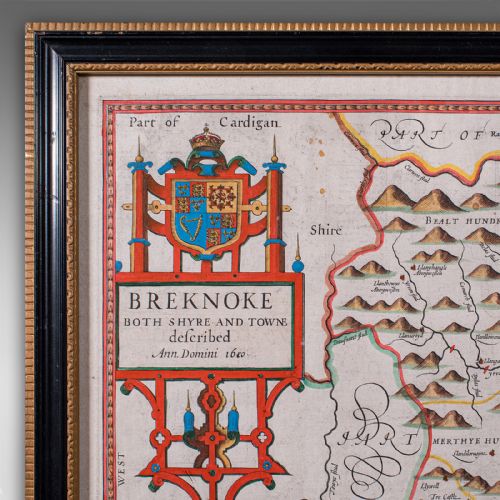 fig 4. A framed seventeenth-century hand-coloured map of Breconshire by John Speed set within a dark ebonised frame with a gilded inner rim.