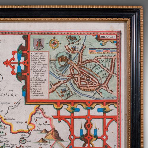 fig 5. A framed seventeenth-century hand-coloured map of Breconshire by John Speed set within a dark ebonised frame with a gilded inner rim.