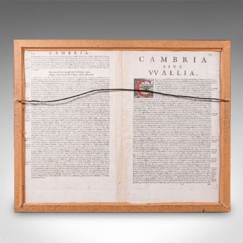 fig 2. A framed antique hand-coloured map of Wales featuring decorative cartouches, sea vessels, and an ebonised frame with a gilded inner moulding.