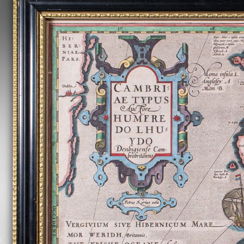 fig 4. A framed antique hand-coloured map of Wales featuring decorative cartouches, sea vessels, and an ebonised frame with a gilded inner moulding.