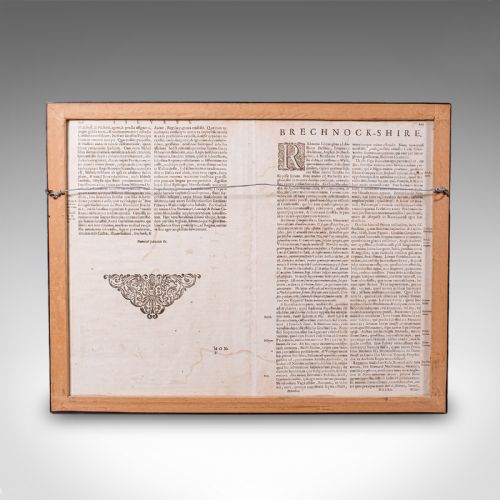 fig 2. A framed 17th-century map of Breconshire featuring hand-coloured coats of arms and a black and gold decorative frame.