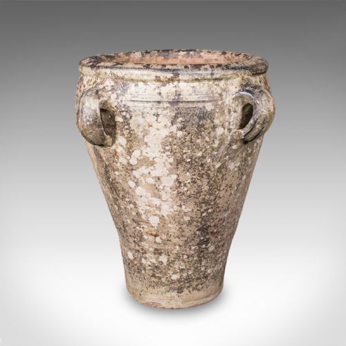 fig 1. A tapered antique Tuscan terracotta planter featuring four side lug handles and a heavily weathered grey lichen patina.