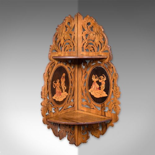 fig 1. A Victorian Italian walnut corner display shelf featuring two tiers, openwork foliage fretwork borders, and oval marquetry panels depicting folk dancers.