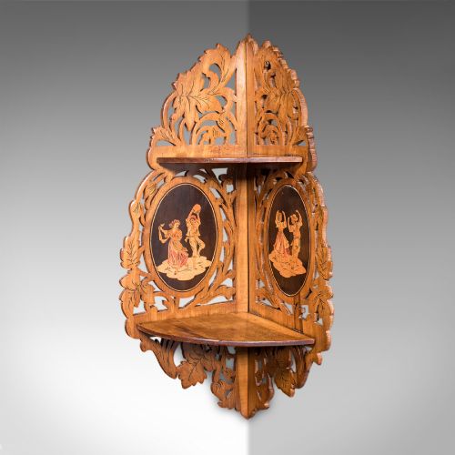fig 3. A Victorian Italian walnut corner display shelf featuring two tiers, openwork foliage fretwork borders, and oval marquetry panels depicting folk dancers.