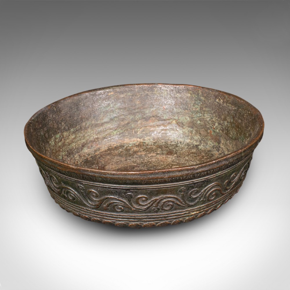 An antique Japanese Edo period bronze censer bowl with carved scrollwork around the exterior wall and patinated interior.