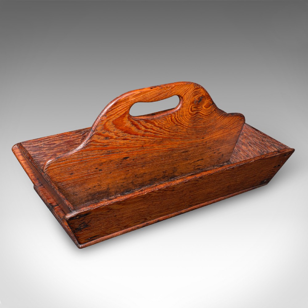 An antique Victorian rectangular wooden garden trug featuring a central raised divider with a carved handle.