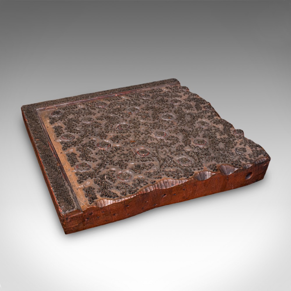 A square Victorian wooden wallpaper printing block crafted from dark wood with raised brass pins forming a repeating pattern.