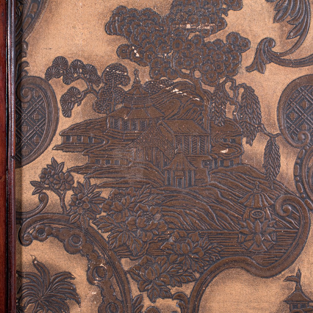 A four-panel mahogany folding room divider featuring patterned chinoiserie canvas panels set within dark wood frames. View VIII