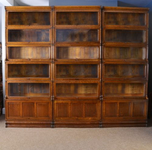 Three Large Oak Sectional Waterfall Bookcases