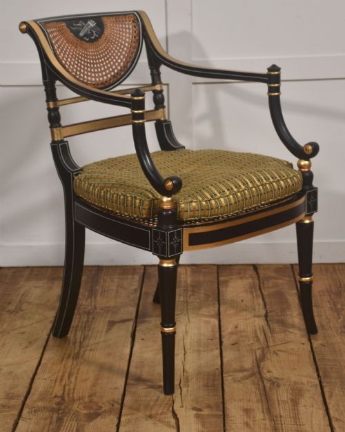 Regency Style Ebonised, Parcel-Gilt And Caned Armchair