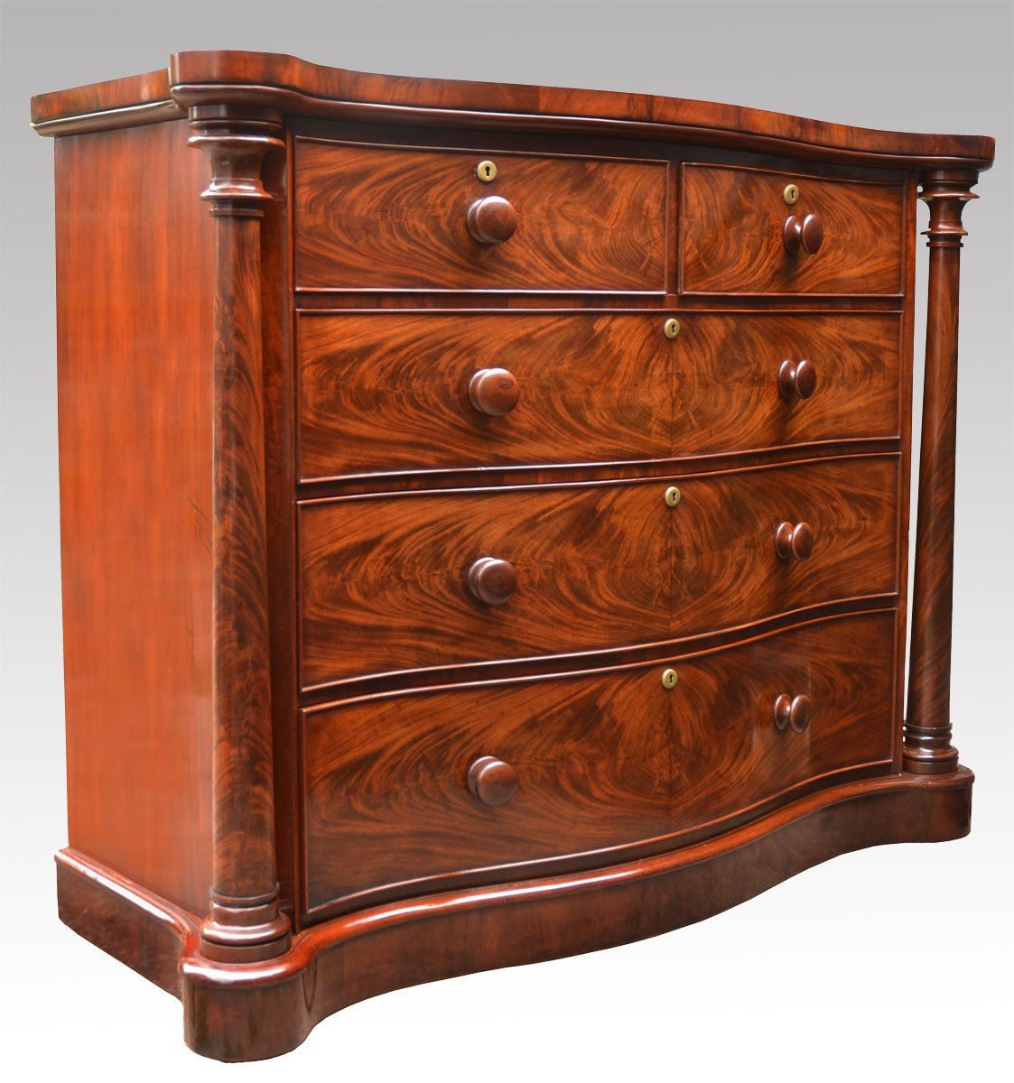 Victorian flame mahogany serpentine fronted chest of draws 