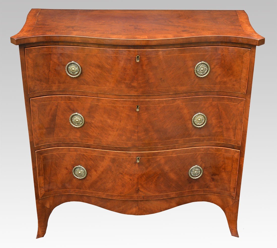 mahogany serpentine fronted chest of draws 