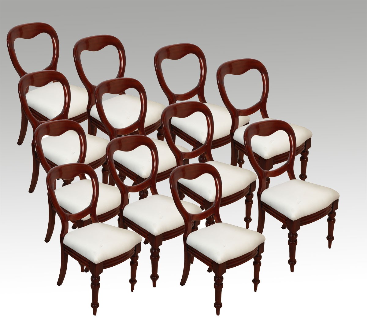 set of twelve mahogany balloon back dining chairs