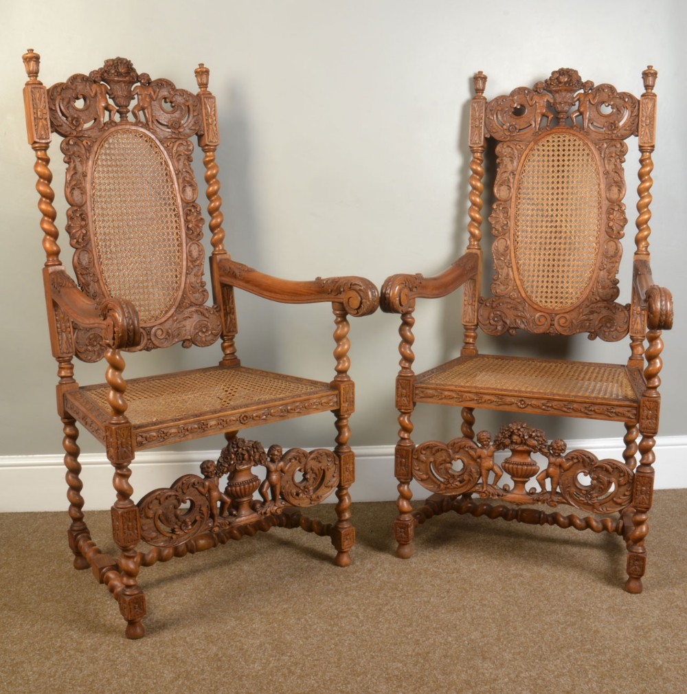 pair of oak bergere arm chairs