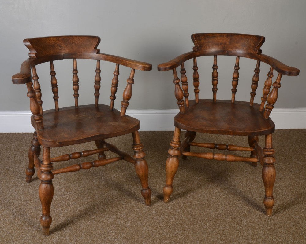 Pair of elm bow smokers elbow chairs 