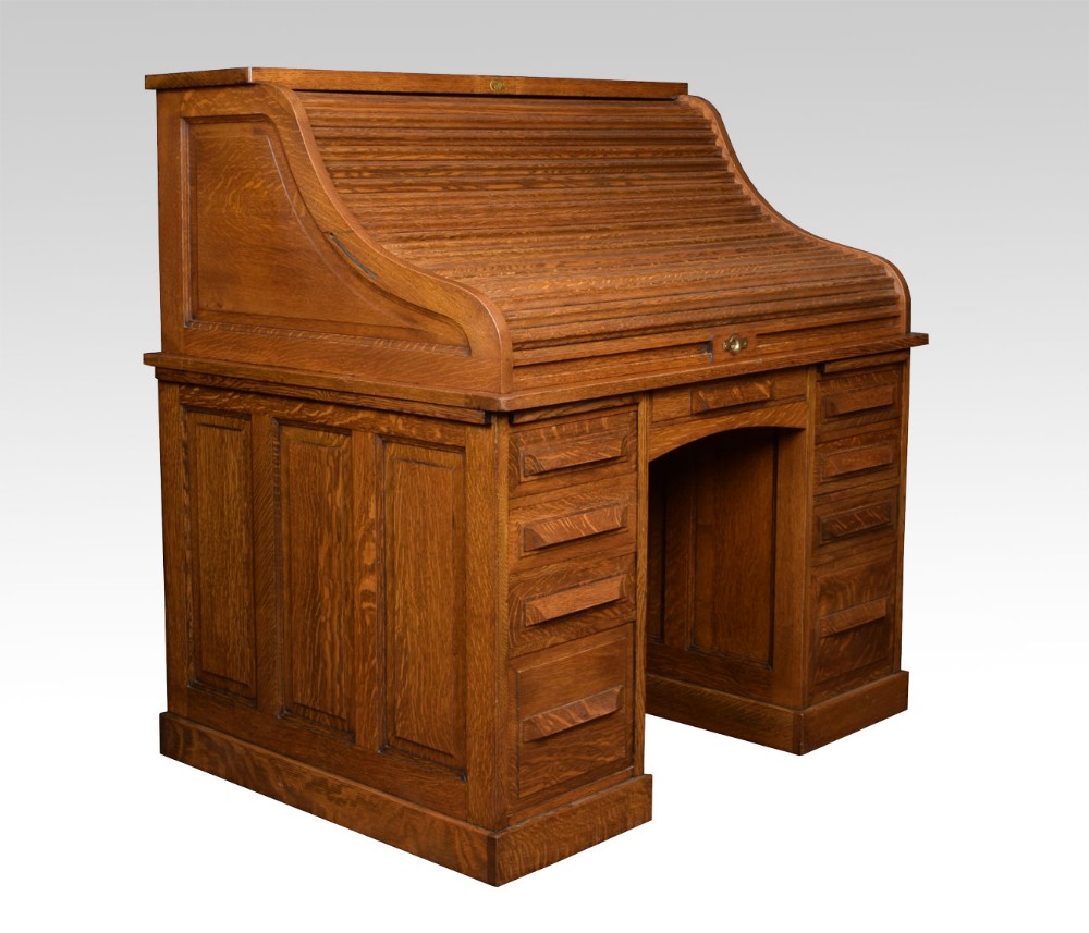 Oak pedestal roll top desk by Cutler 