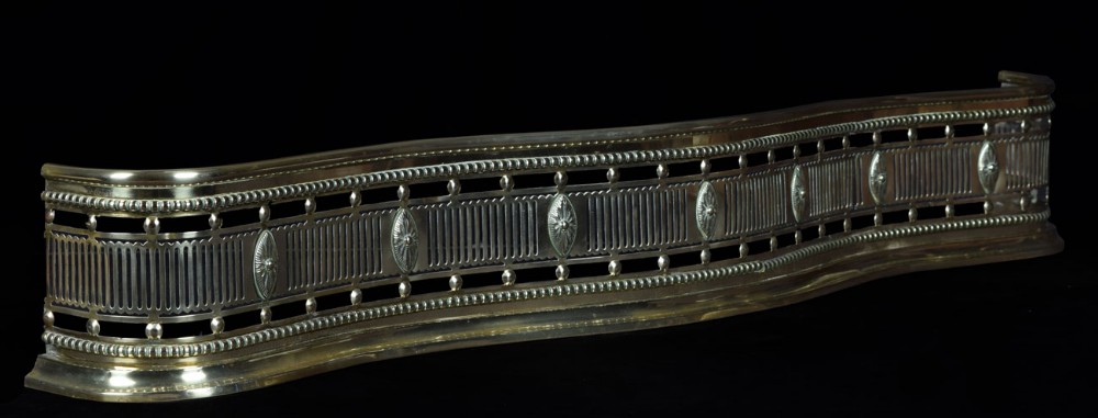 Georgian brass serpentine shaped fender