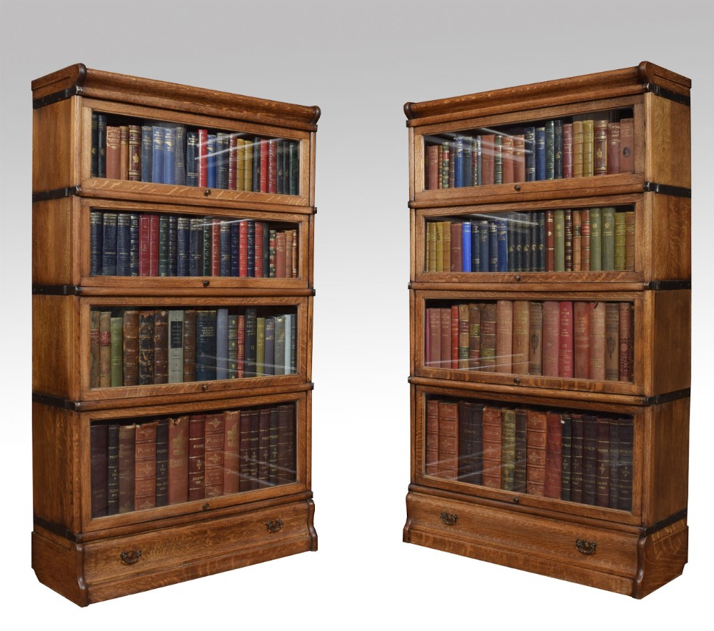 Pair Oak globe Wernicke four section bookcases