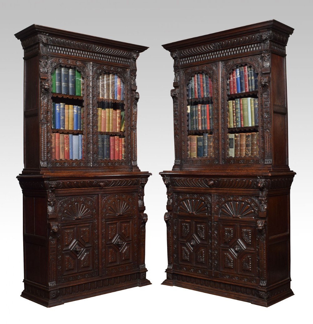 Pair Renaissance revival carved oak bookcase cabinets