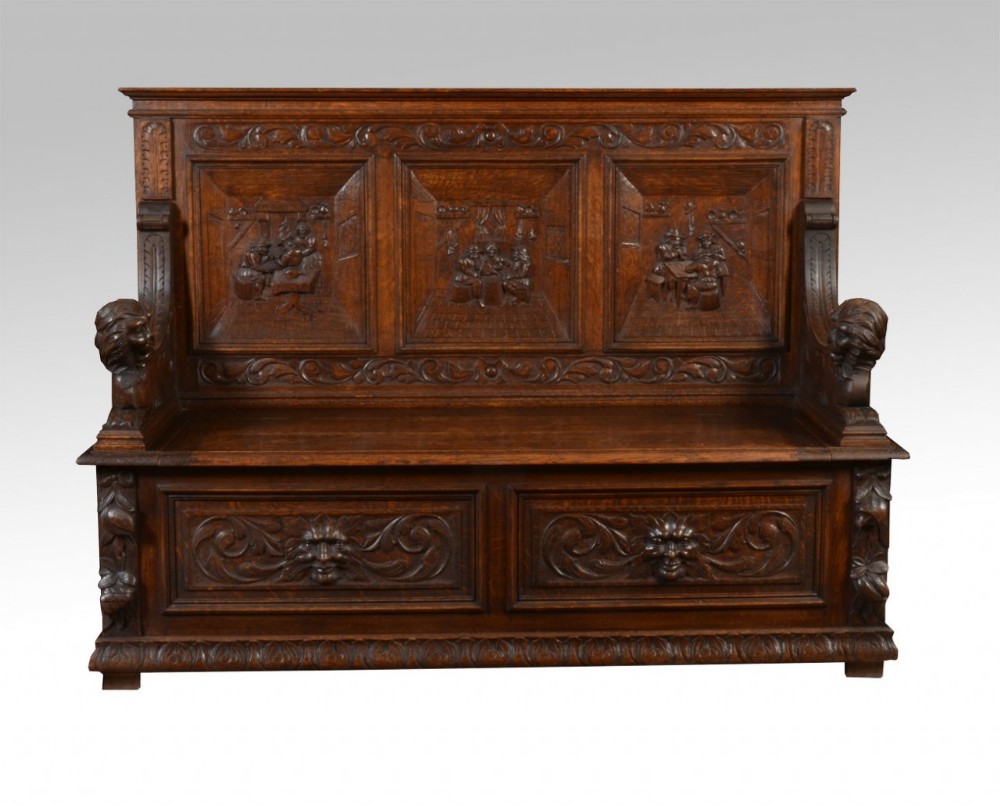 Carved oak hall settle