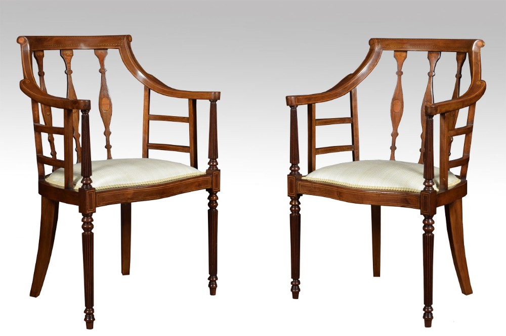 Pair of Edwardian Mahogany inlaid arm chairs 