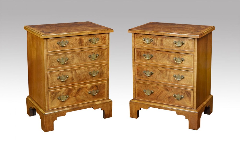 Pair of small walnut chests of drawers