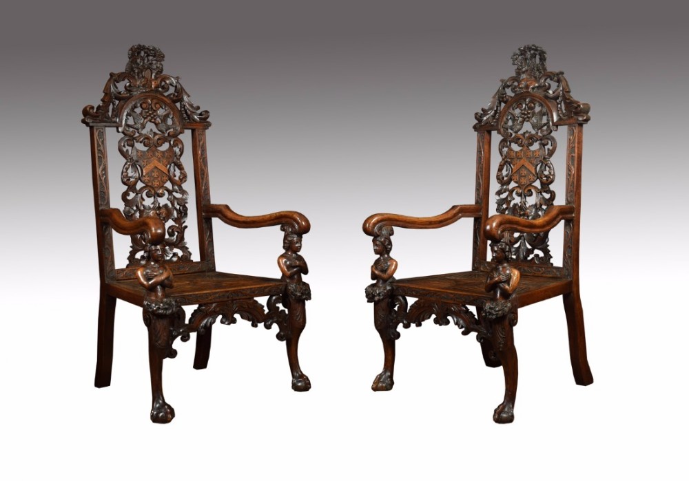 Pair of 19 Century carved oak armorial Armchairs