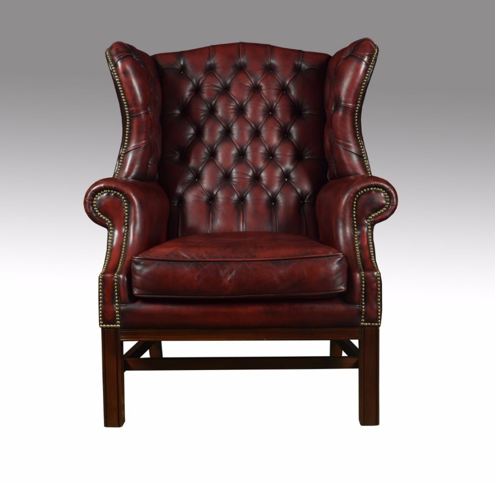 Leather upholstered wingback armchair