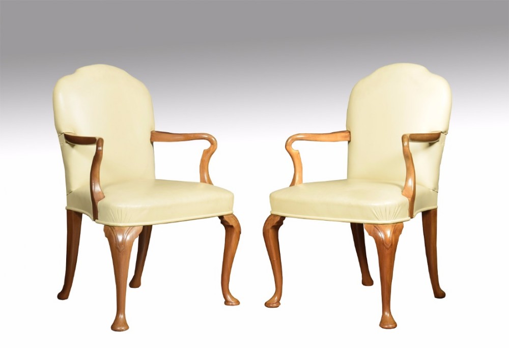 Pair of walnut Queen Ann leather armchairs