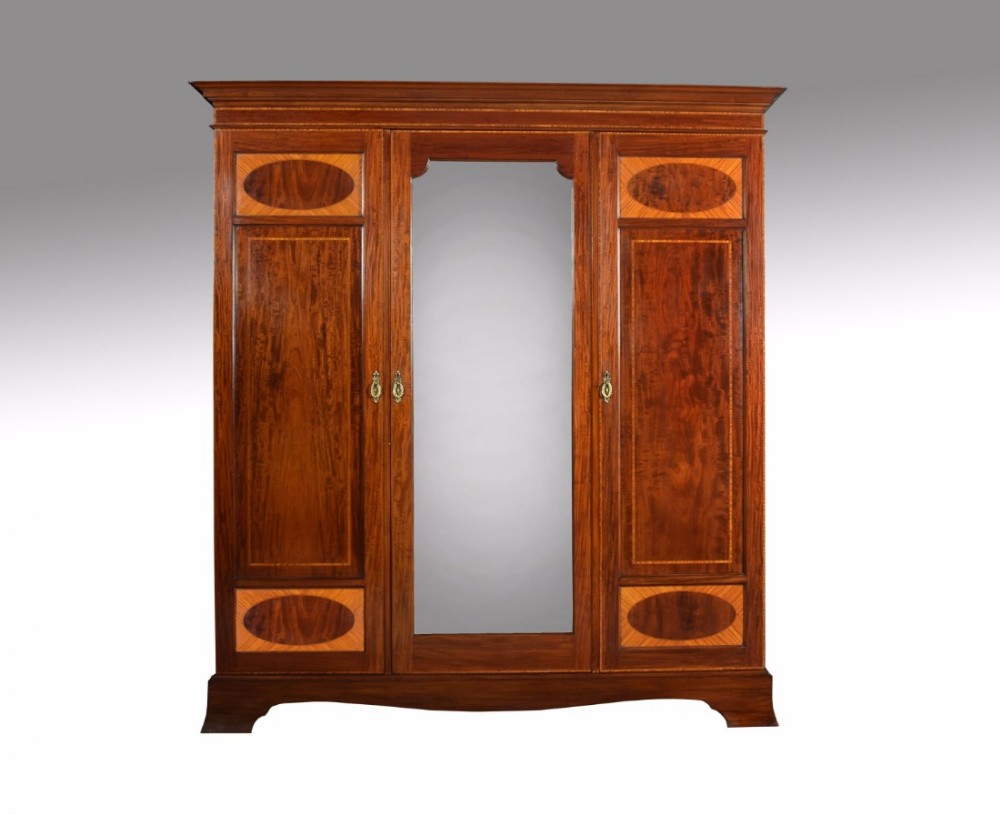 Edwardian mahogany inlaid three door wardrobe
