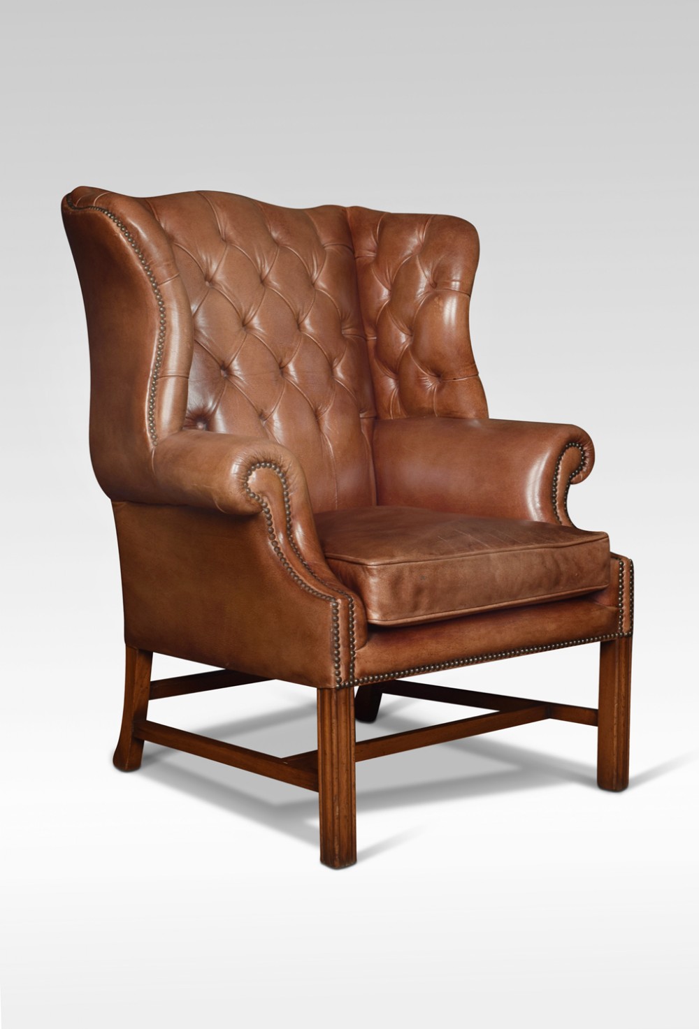 Leather upholstered wingback armchair