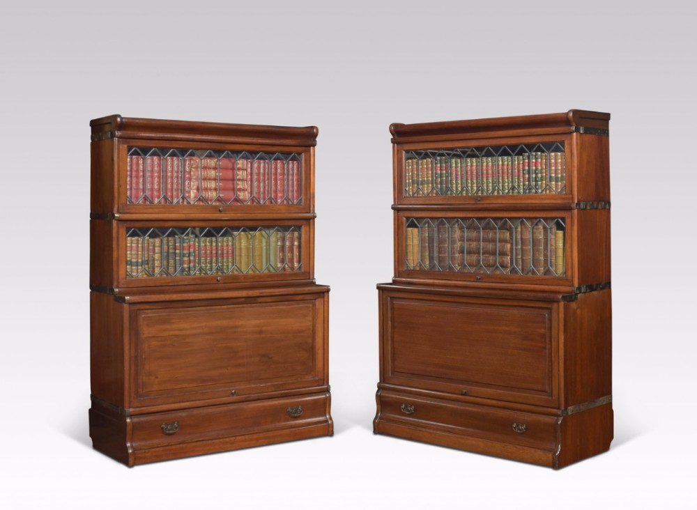 Pair of mahogany globe Wernicke three section bookcases
