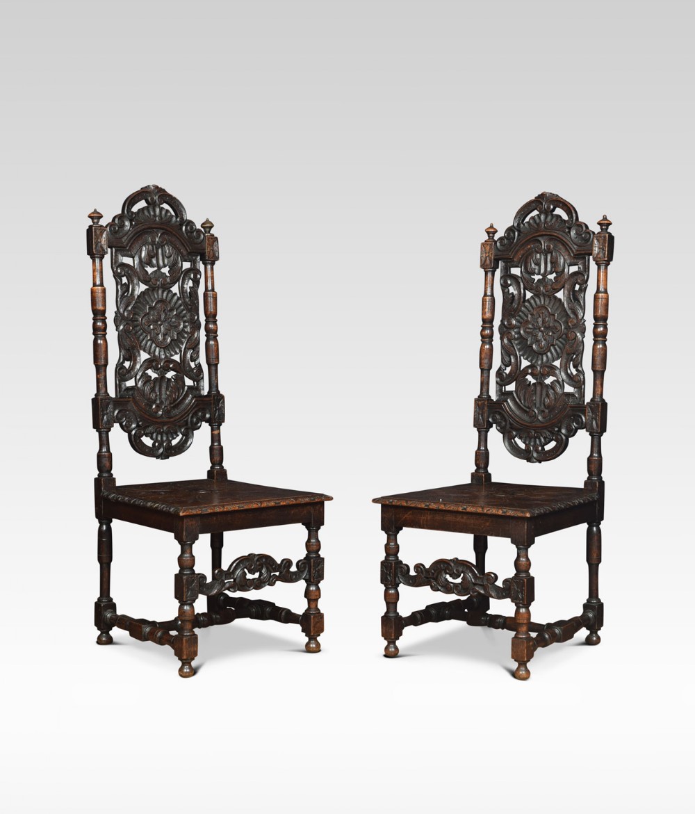Pair of Victorian Jacobean Revival carved oak side chairs