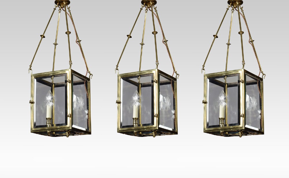 Set of three gilt brass hall lanterns