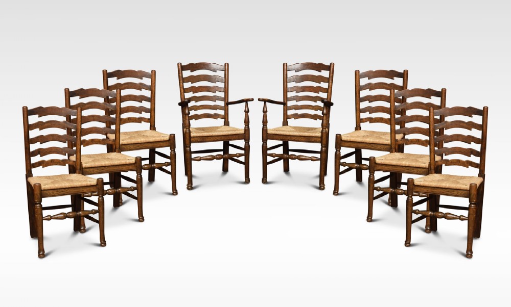 Set of eight oak ladder back dining chairs