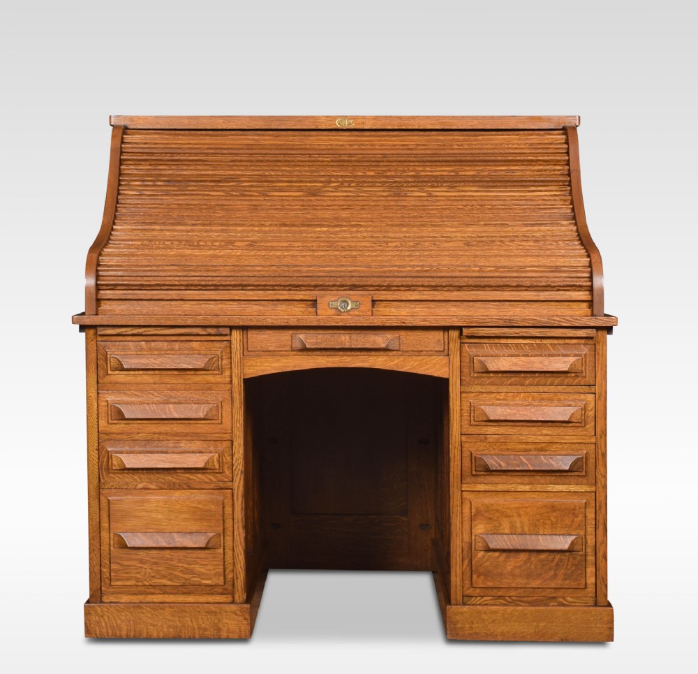 Oak pedestal roll top desk by Cutler