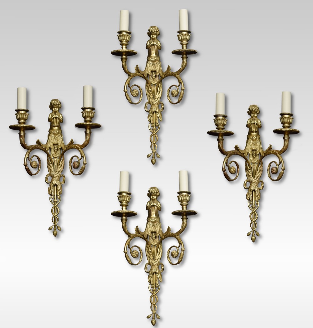 Set of four French gilded bronze wall lights
