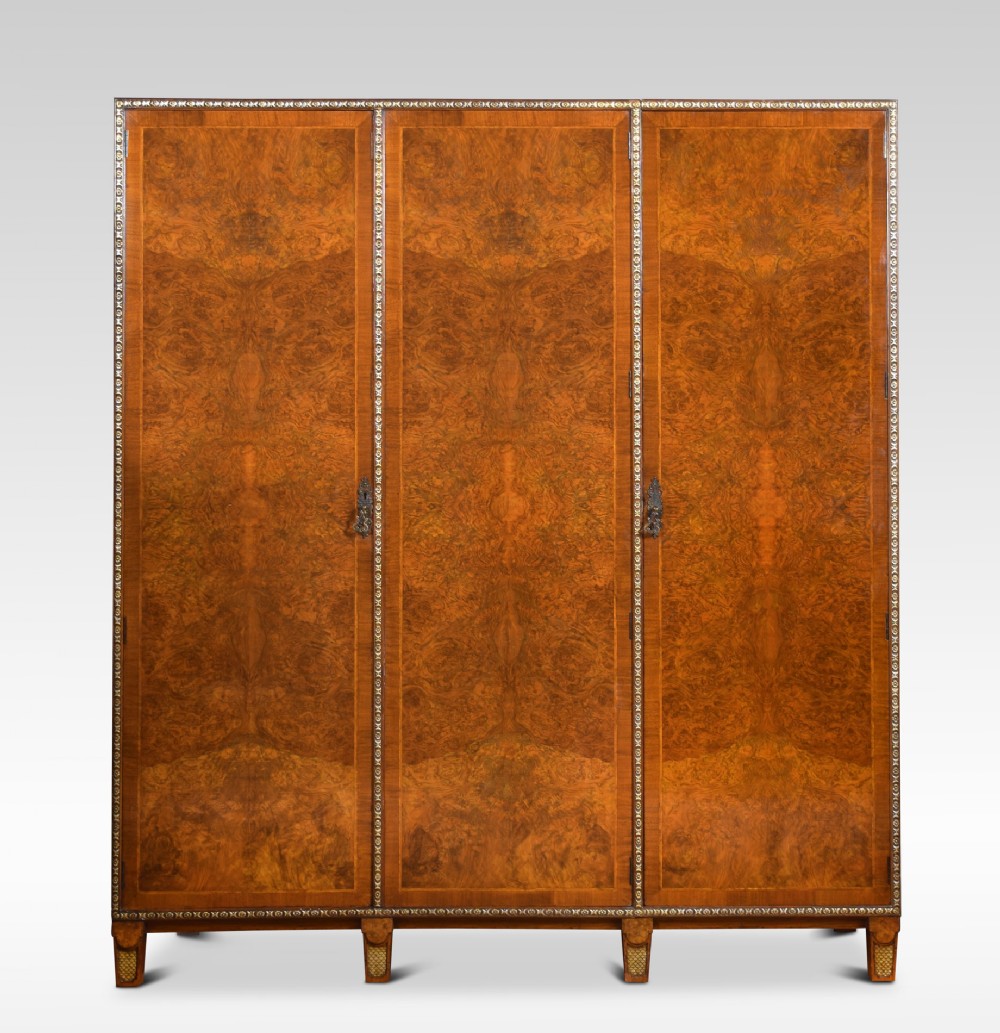 Figured walnut and parcel compactum wardrobe