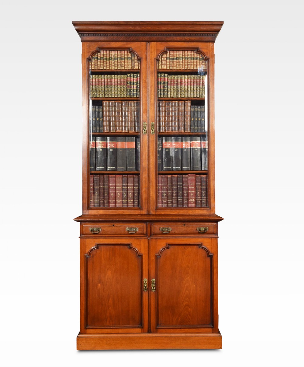 Two door narrow walnut bookcase