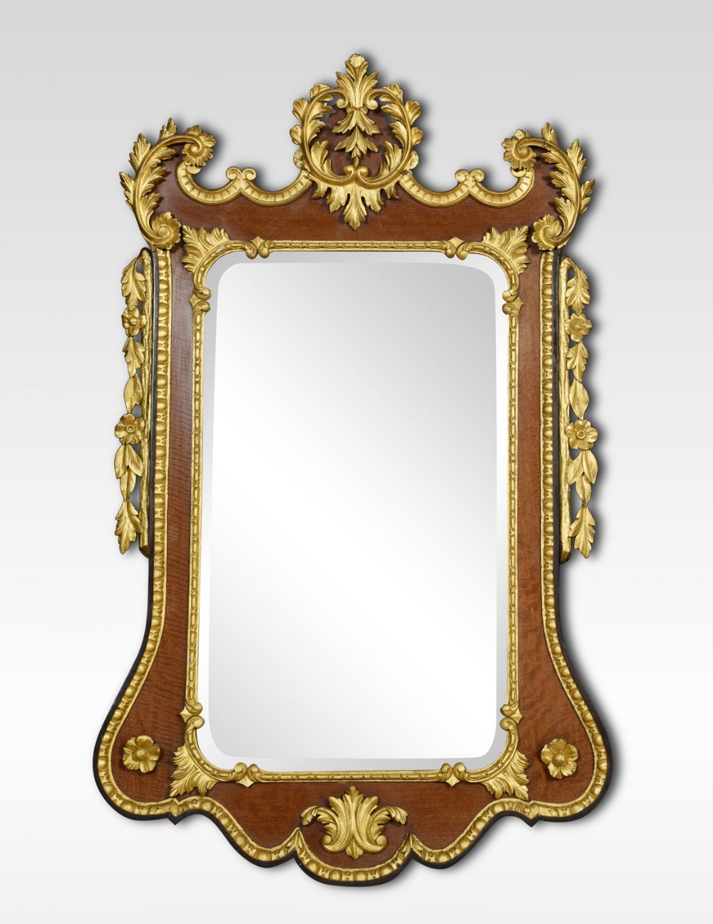 George II style mahogany and parcel gilt wall mirror
