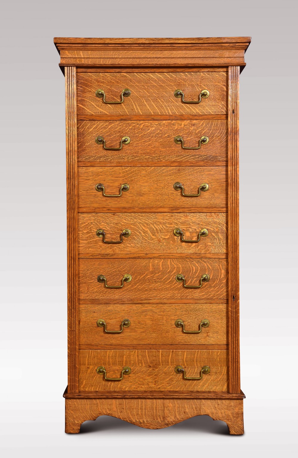 Oak seven drawer Wellington chest