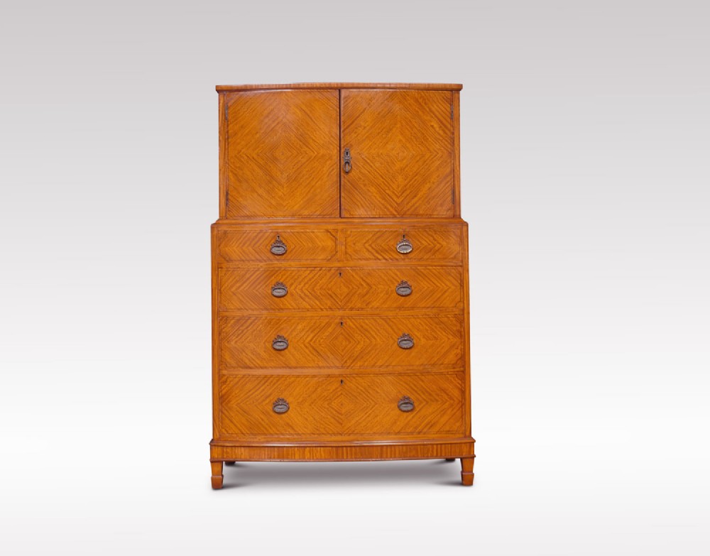 Satinwood bow fronted tallboy