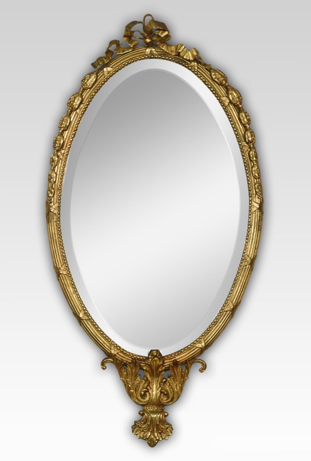 Oval gilded wall mirror