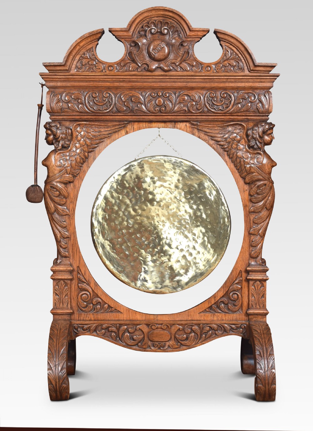 Monumental carved oak dinner gong