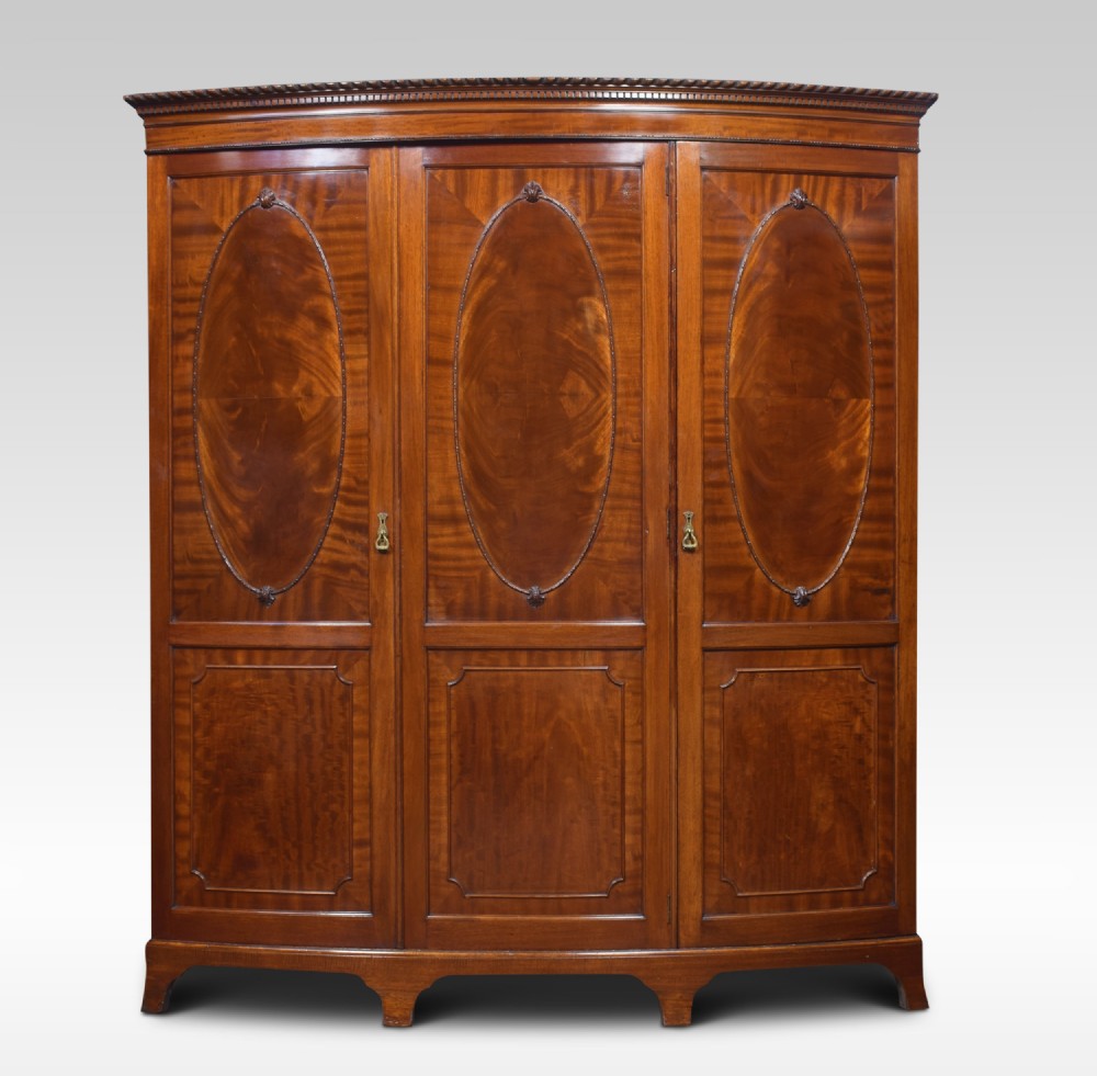 Mahogany bow fronted three door compactum wardrobe