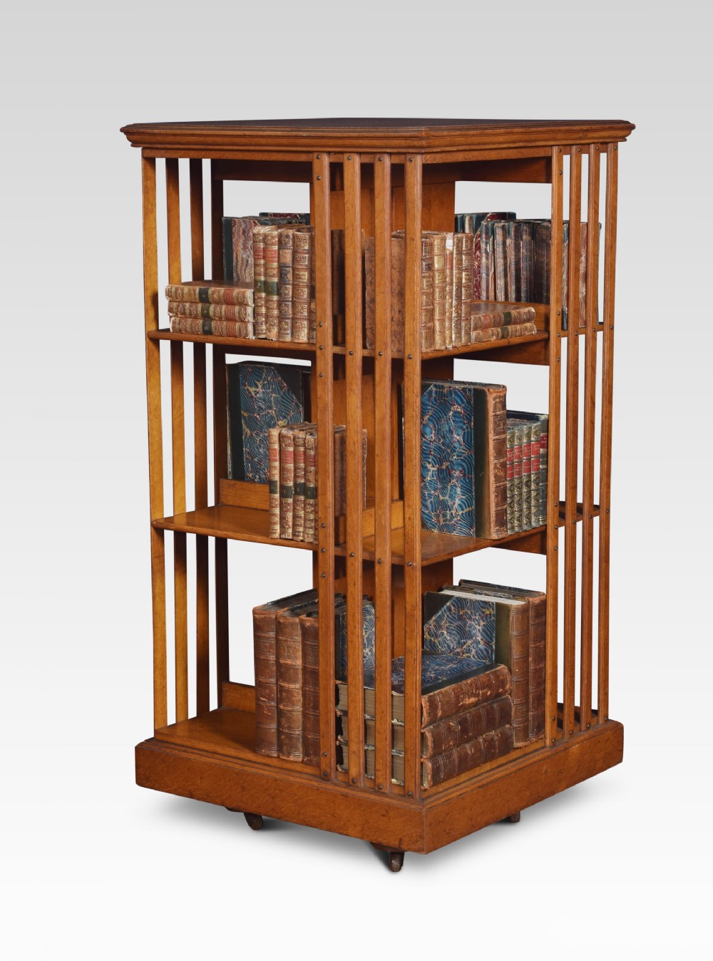 Oak three tier revolving bookcase